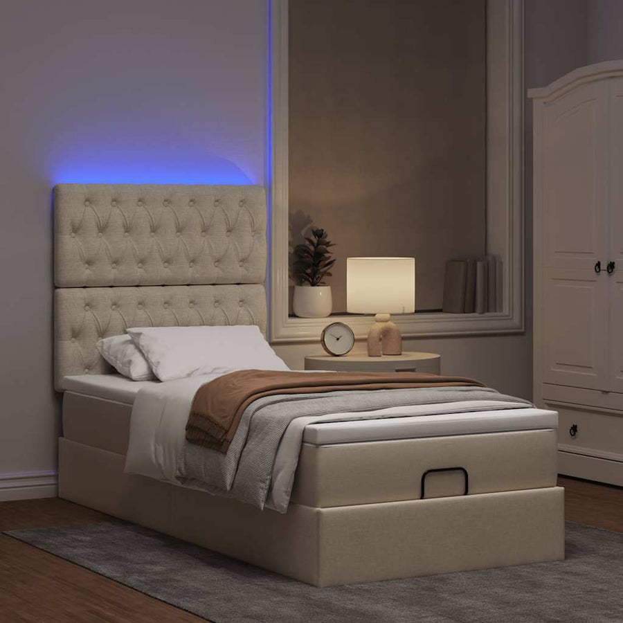 Ottoman bed met matras en LED's 90x200cm stof crèmekleurig