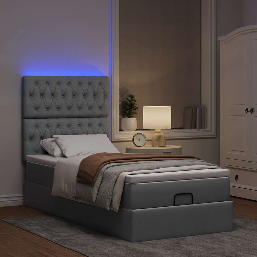 Ottoman bed met matras en LED's 100x200cm stof lichtgrijs