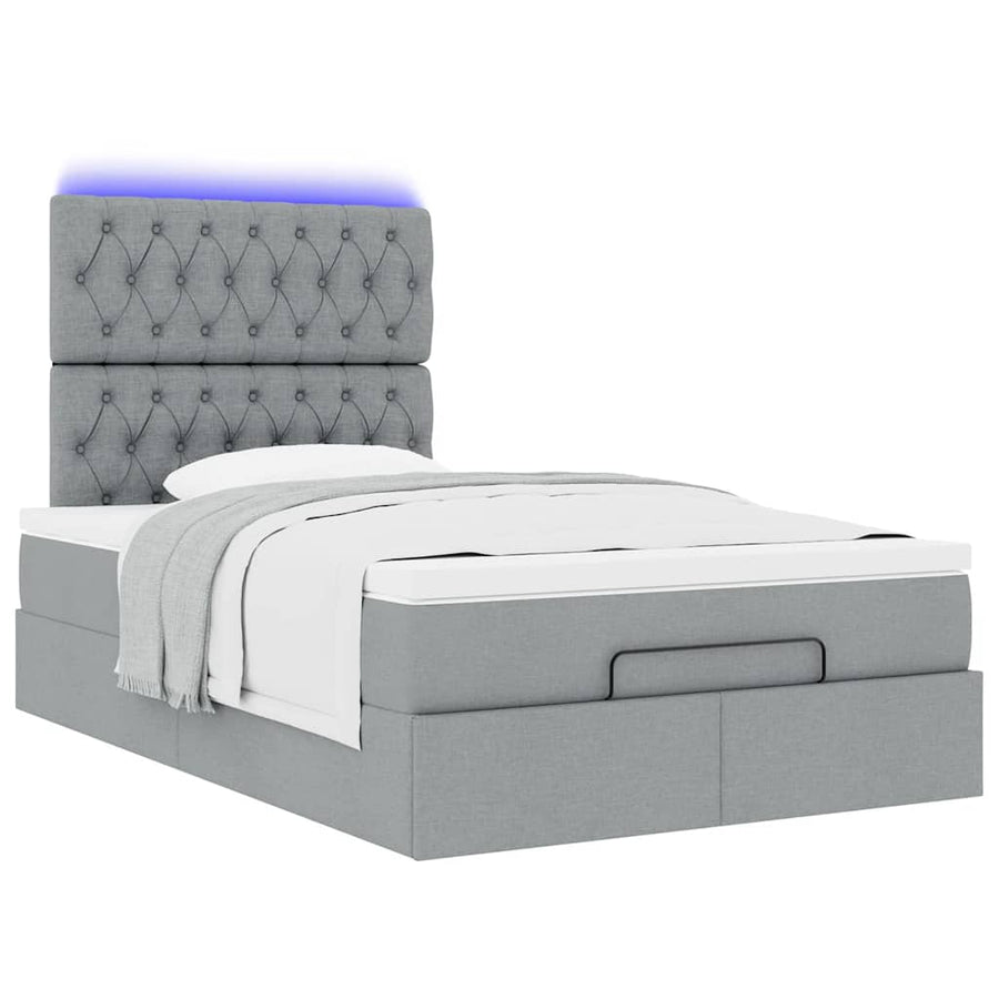 Ottoman bed met matras en LED's 120x190 cm stof lichtgrijs
