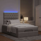 Ottomaans bed met matras en LED 120x190 cm stof taupe