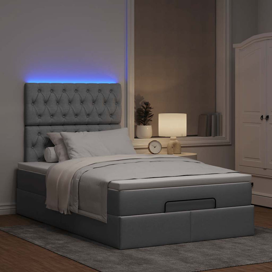 Ottoman bed met matras en LED's 120x200cm stof lichtgrijs