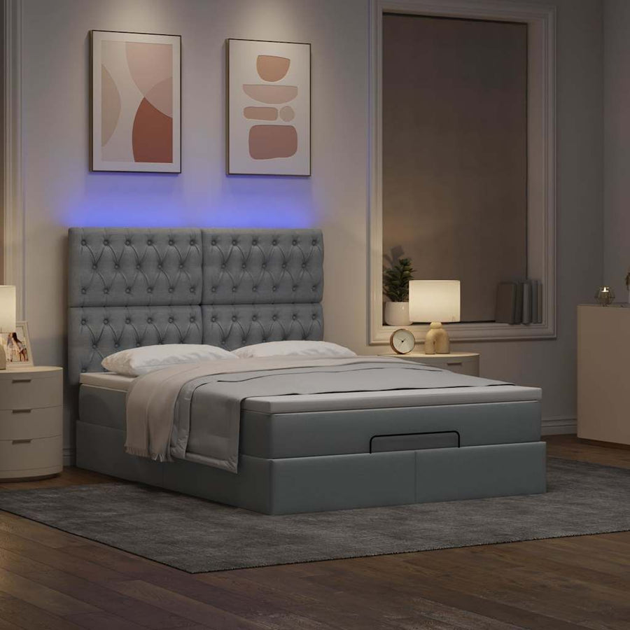 Ottoman bed met matras en LED's 140x190cm stof lichtgrijs