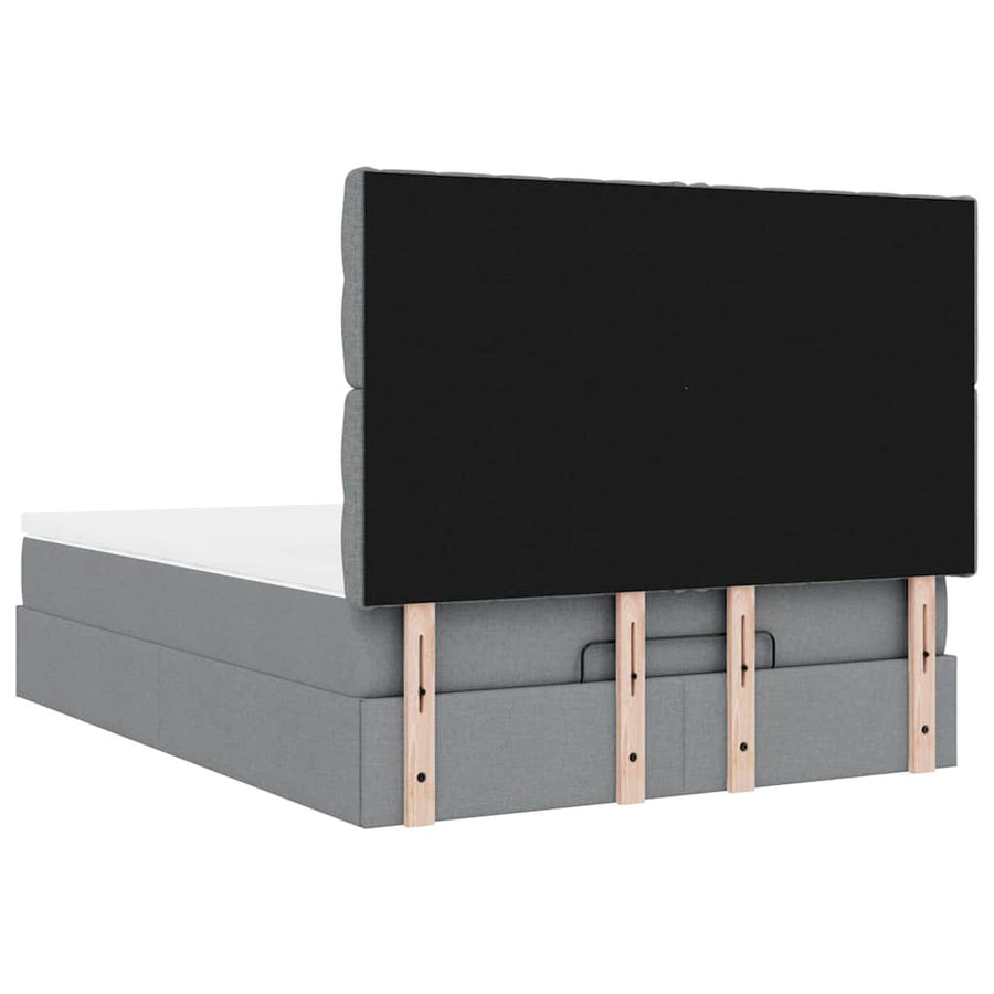 Ottoman bed met matras en LED's 140x190cm stof lichtgrijs
