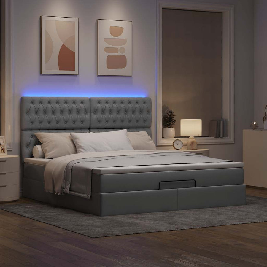 Ottoman bed met matras en LED's 180x200cm stof lichtgrijs