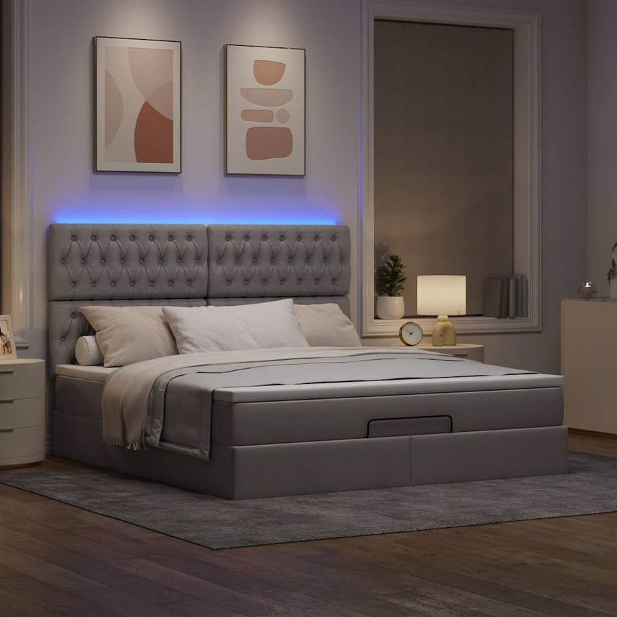 Ottoman bed met matras en LED's 180x200cm stof taupe