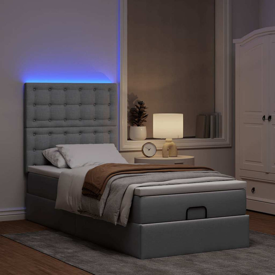 Ottoman bed met matras en LED's 90x190cm stof lichtgrijs