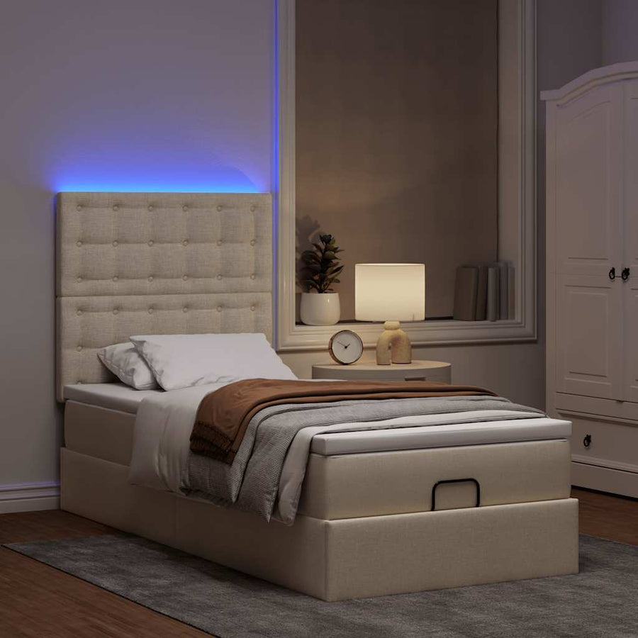 Ottoman bed met matras en LED's 90x190cm stof crèmekleurig