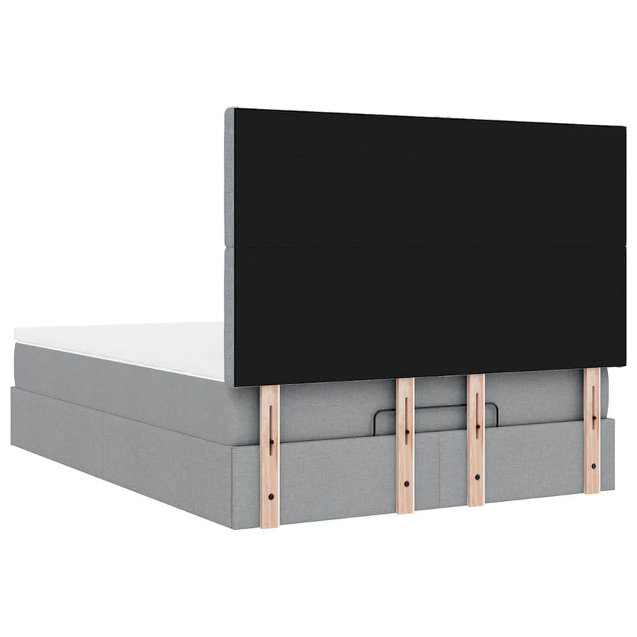 Ottoman bed met matras en LED's 140x190cm stof lichtgrijs