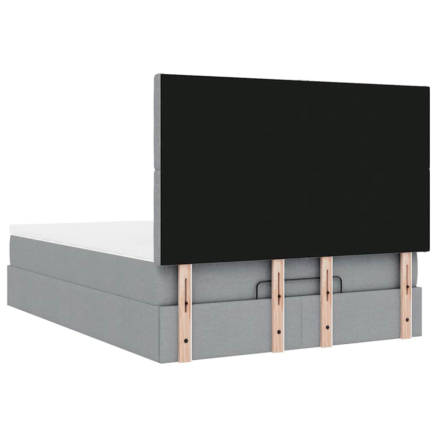 Ottoman bed met matras en LED's 140x200cm stof lichtgrijs