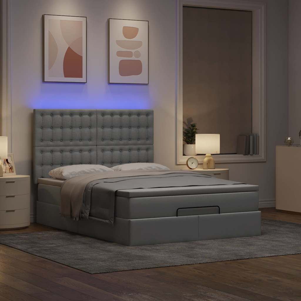 Ottoman bed met matras en LED's 140x200cm stof lichtgrijs