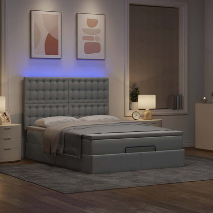 Ottoman bed met matras en LED's 140x200cm stof lichtgrijs