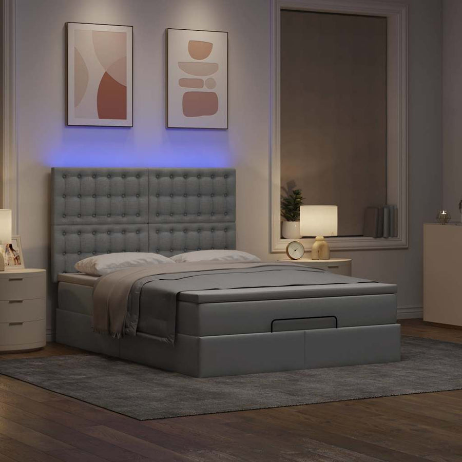 Ottoman bed met matras en LED's 140x200cm stof lichtgrijs