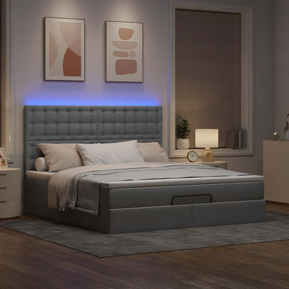 Ottoman bed met matras en LED's 160x200cm stof lichtgrijs