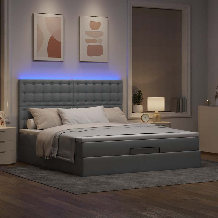 Ottoman bed met matras en LED's 180x200cm stof lichtgrijs