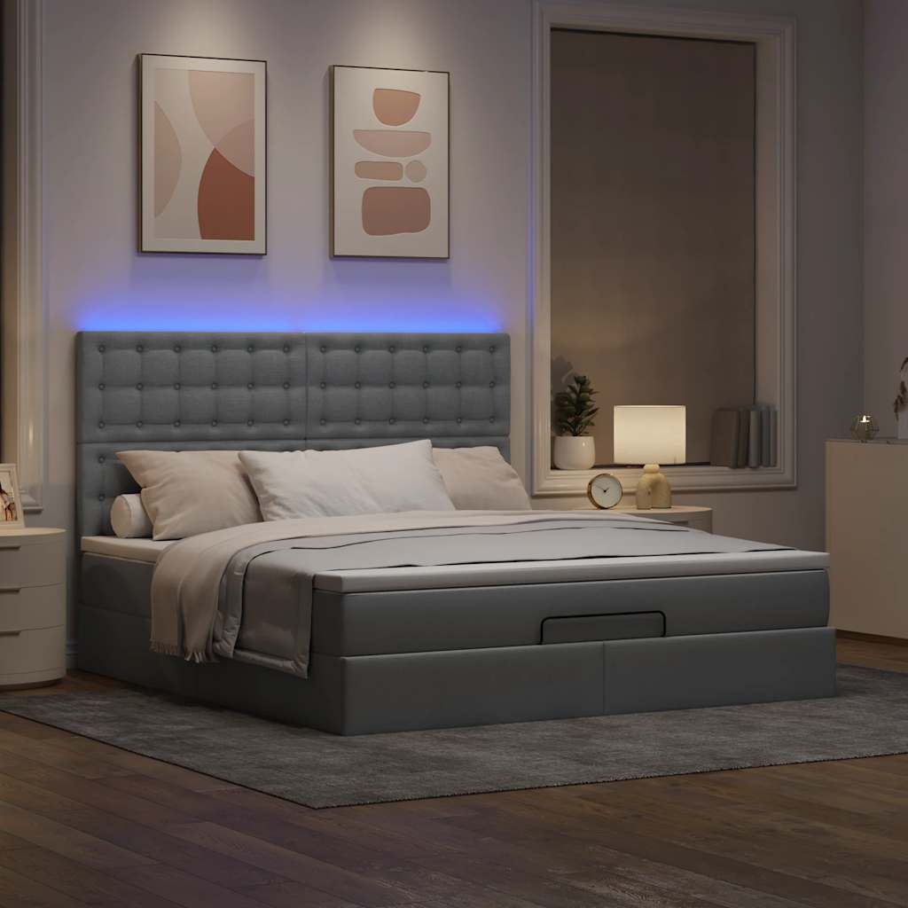 Ottoman bed met matras en LED's 180x200cm stof taupe