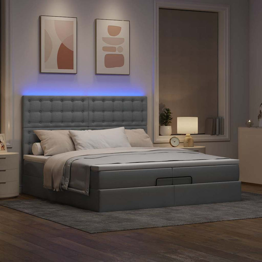 Ottoman bed met matrassen en LED's 200x200cm stof lichtgrijs