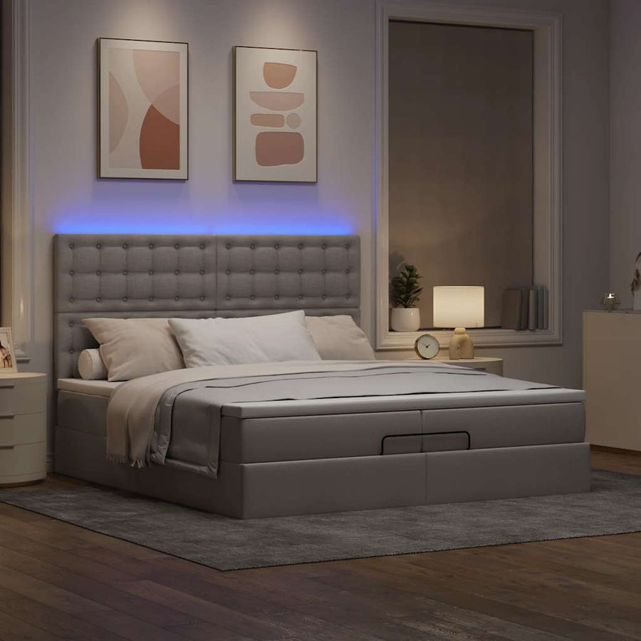 Ottoman bed met matrassen en LED's 200x200cm stof taupe