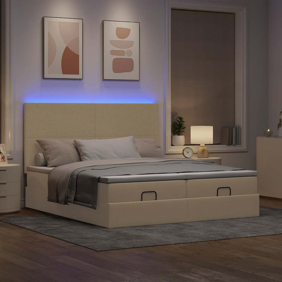 Ottoman bed met matrassen en LED's 180x200cm stof crèmekleurig