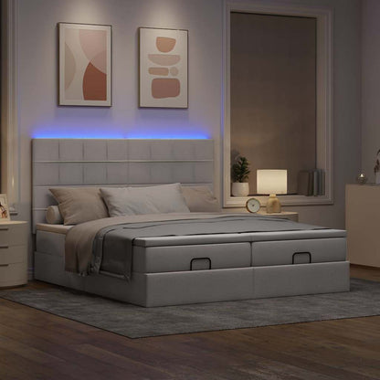 Ottoman bed met matrassen en LED's 160x200cm stof taupe