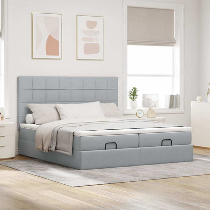 Ottoman bed met matrassen en LED's 180x200cm stof lichtgrijs