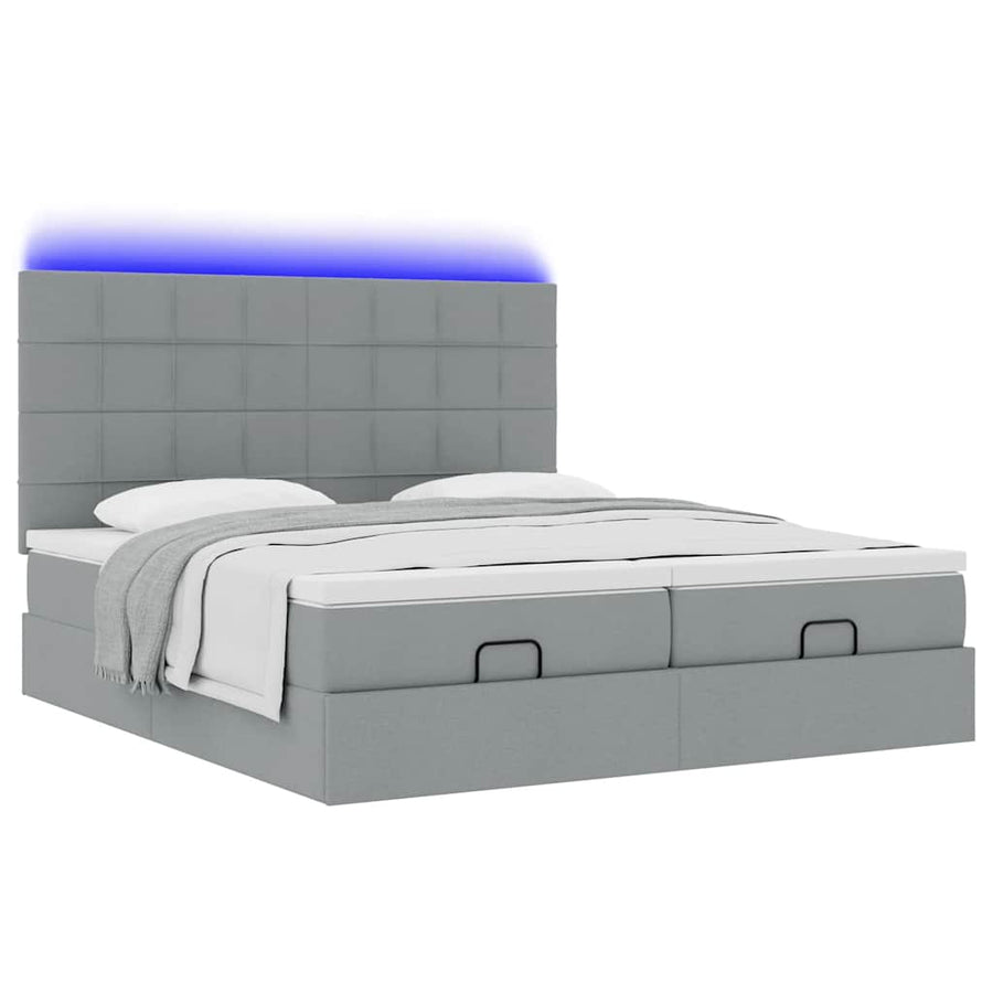 Ottoman bed met matrassen en LED's 180x200cm stof lichtgrijs