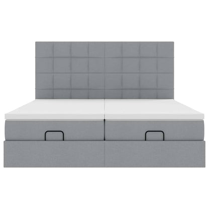Ottoman bed met matrassen en LED's 180x200cm stof lichtgrijs