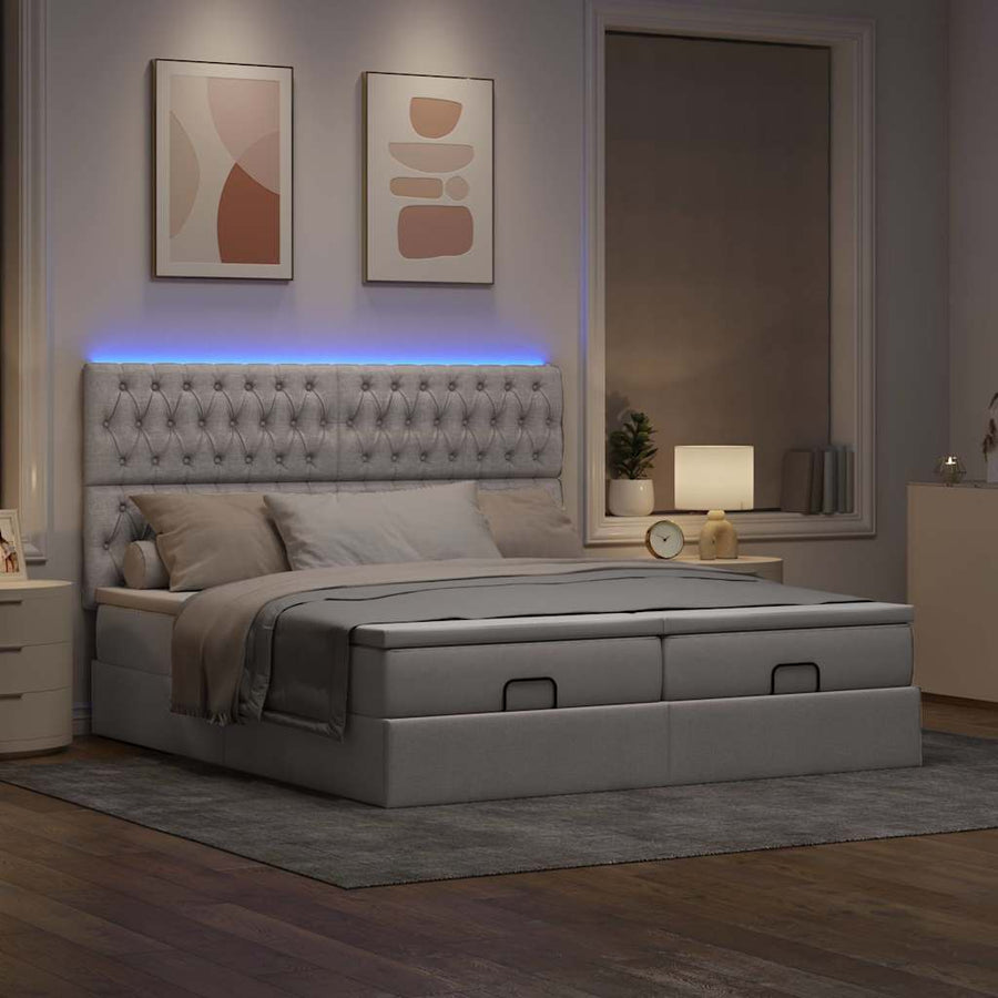 Ottoman bed met matrassen en LED's 160x200cm stof taupe