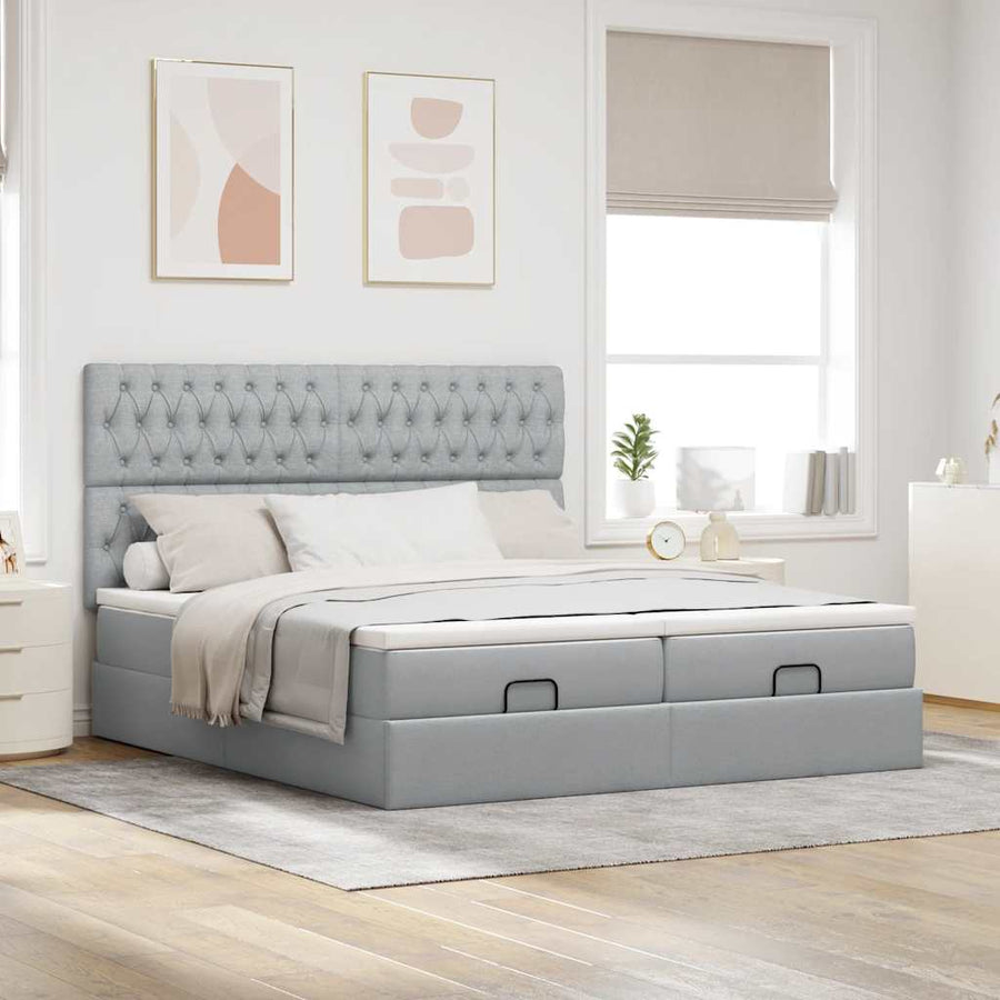 Ottoman bed met matrassen en LED's 180x200cm stof lichtgrijs