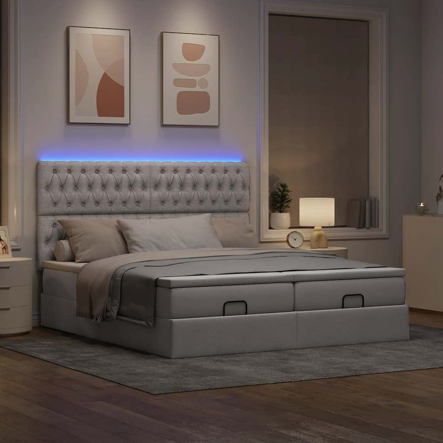 Ottoman bed met matrassen en LED's 180x200cm stof taupe
