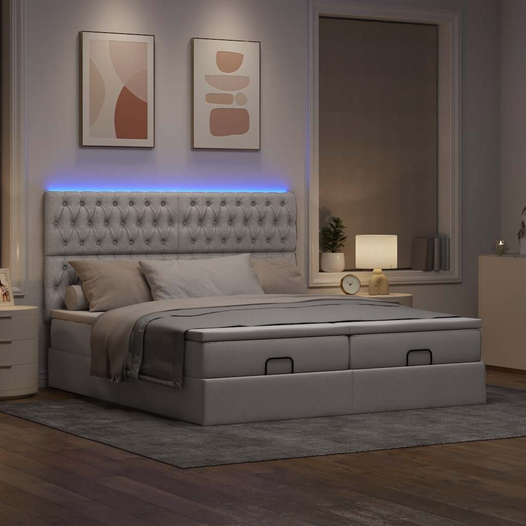 Ottoman bed met matrassen en LED's 200x200cm stof taupe