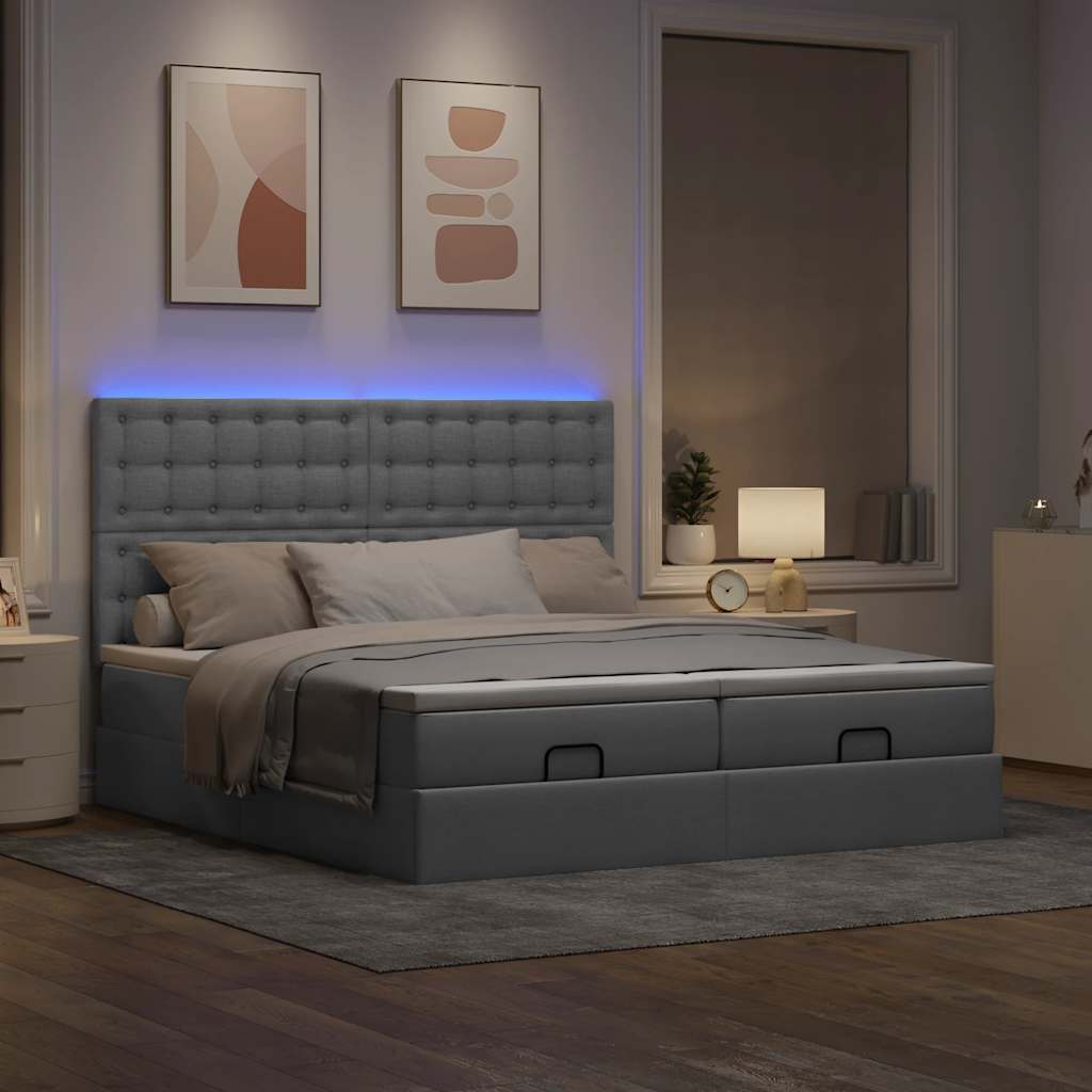 Ottoman bed met matrassen en LED's 160x200cm stof lichtgrijs
