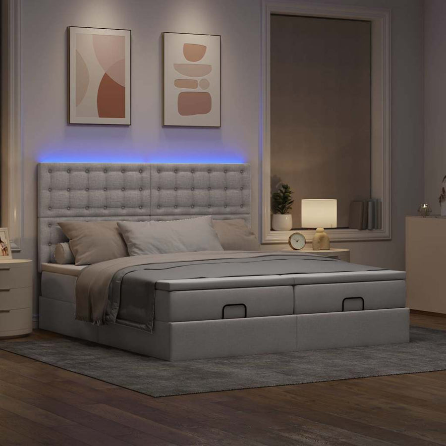 Ottoman bed met matrassen en LED's 160x200cm stof taupe