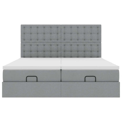 Ottoman bed met matrassen en LED's 180x200cm stof lichtgrijs