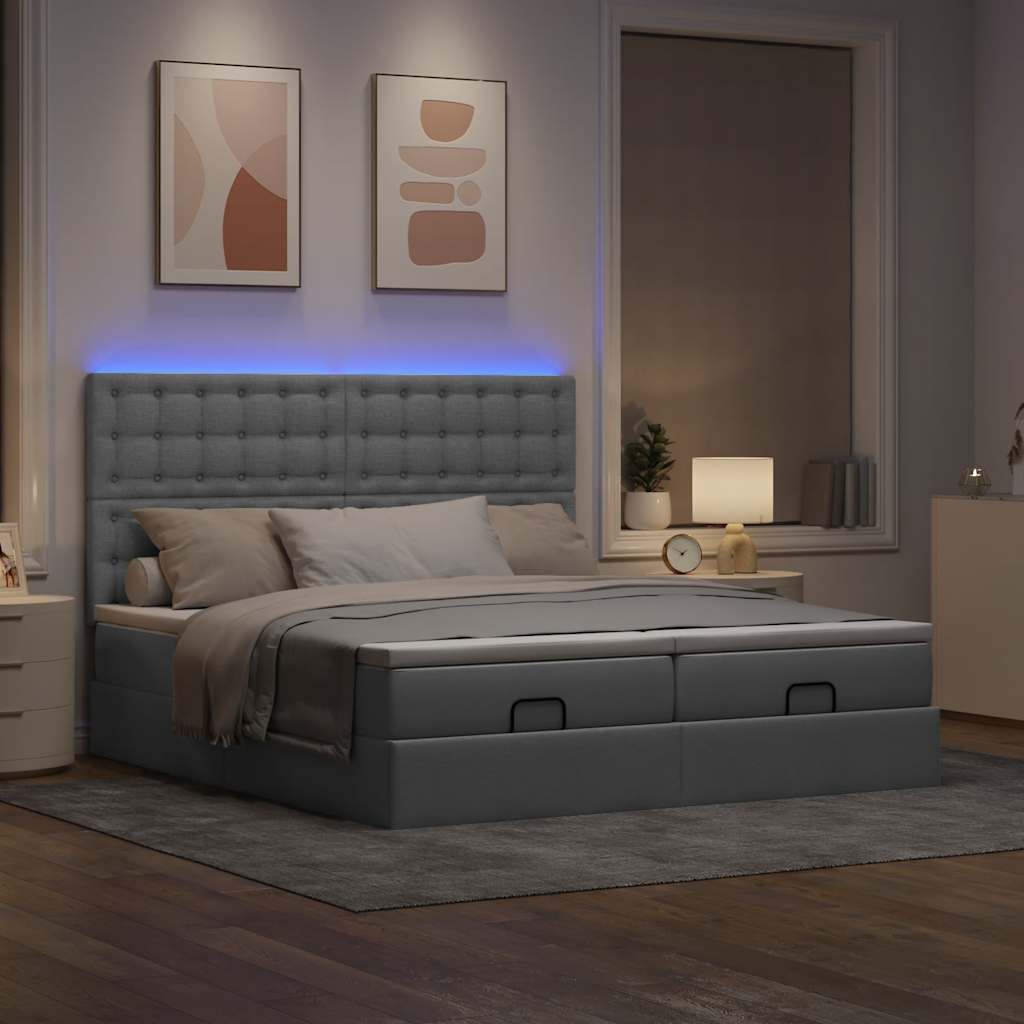Ottoman bed met matrassen en LED's 180x200cm stof lichtgrijs