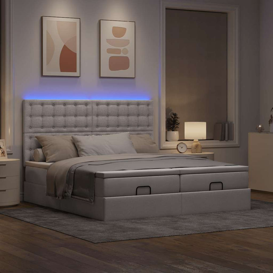 Ottoman bed met matrassen en LED's 200x200cm stof taupe
