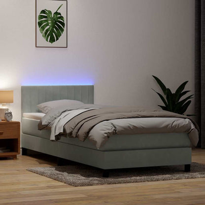 Boxspring met matras en LED fluweel lichtgrijs 90x220 cm