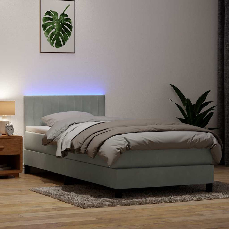 Boxspring met matras en LED fluweel lichtgrijs 90x220 cm