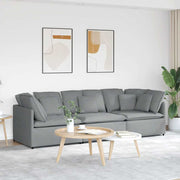 Modular sofa with light grey fabric cushions