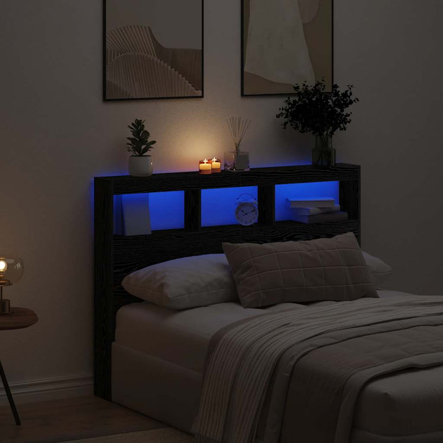Hoofdbordkast met LED 140x17x102 cm zwart eikenkleurig