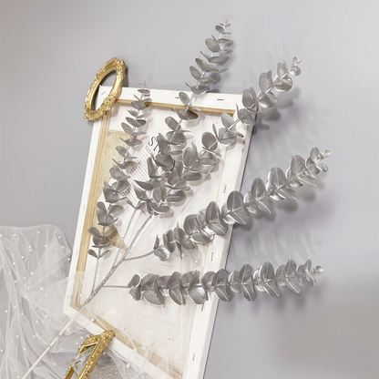 Decoratieve eucalyptus tak 90 cm zilver