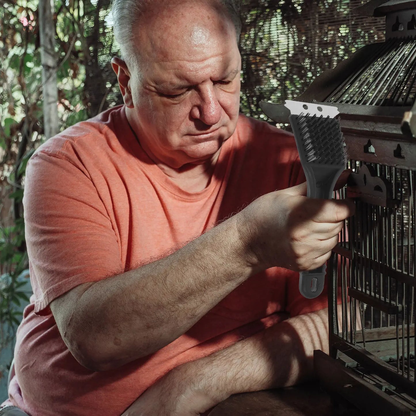 Vogelkooiborstel met lange steel en RVS schraper