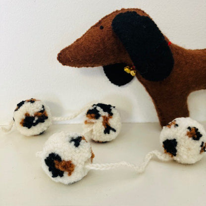 Slinger pompom luipaard off-wit 2m wol