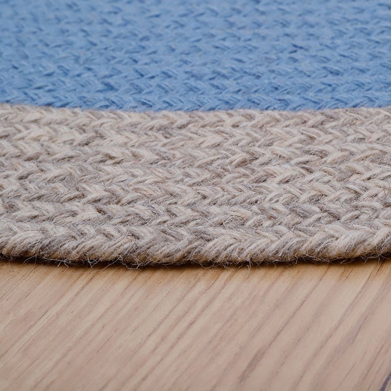 NOLAN BLAUW kindervloerkleed van gevlochten wol