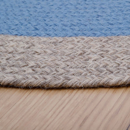 NOLAN BLAUW kindervloerkleed van gevlochten wol