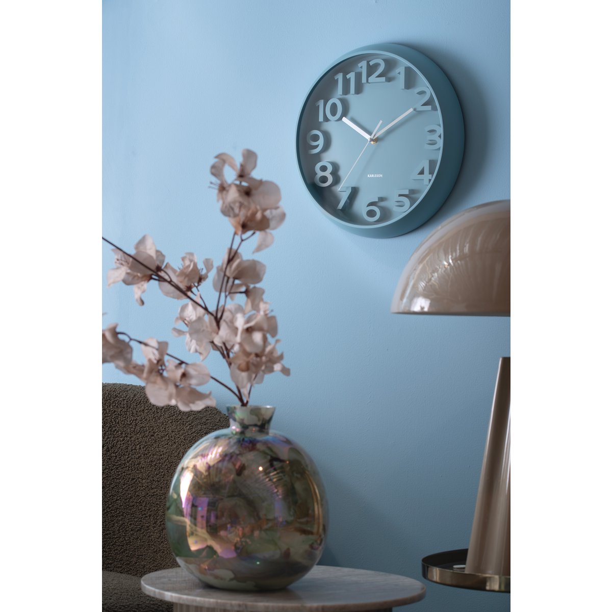 Wall clock raised classical numerals
