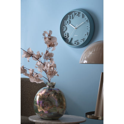 Wall clock raised classical numerals