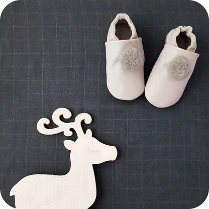 Baby booties with pompoms Grey