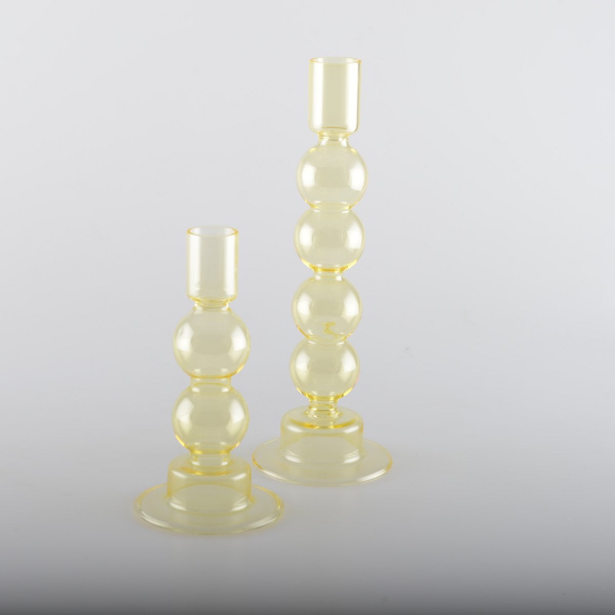 Kandelaars glas geel set van 2