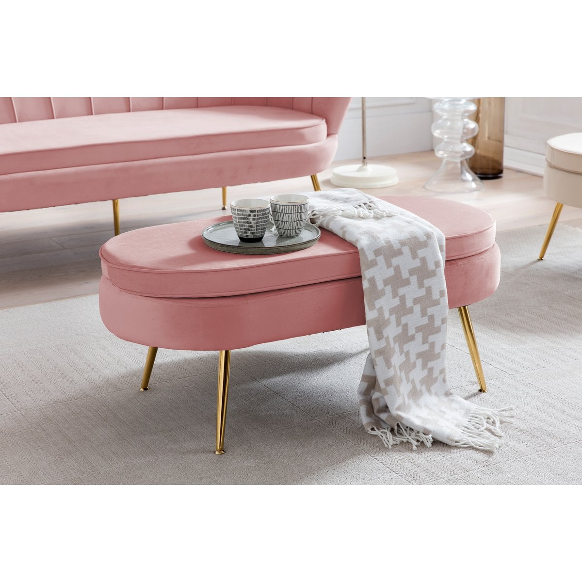 Oval pouffe made of rose velvet
