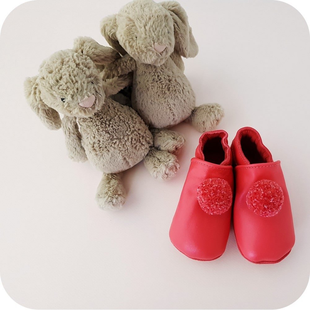 Babyslofjes leer fuchsia pompons